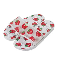 Strawberry print slide sandals with white straps and red patterned top, chunky sole