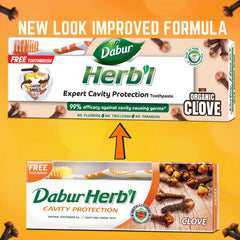 Dabur Herbal toothpaste packaging showing clove toothpaste for cavity protection with organic clove images and free toothbrush