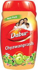 Dabur Chyawanprash 1kg red jar with family image and amla fruits on label for immune support