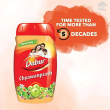 Dabur Chyawanprash jar with time tested badge, red cap and beige label with fruit