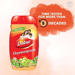 Dabur Chyawanprash 1kg red jar with family image new pack label and amla fruit illustration
