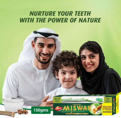 Dabur Miswak toothpaste with toothbrush shown with smiling family in traditional dress and herbal pack