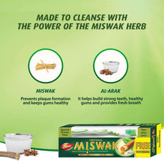 Dabur Miswak toothpaste with toothbrush. Green promo image showing Miswak herb benefits product box and free toothbrush