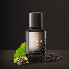 David Beckham Beyond perfume for men bottle with cardamom pods green leaf and black peppercorns