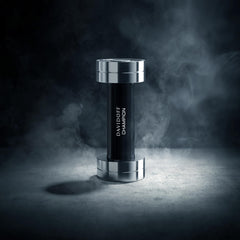 Davidoff Champion for men perfume bottle designed like a silver and black dumbbell on smoky background
