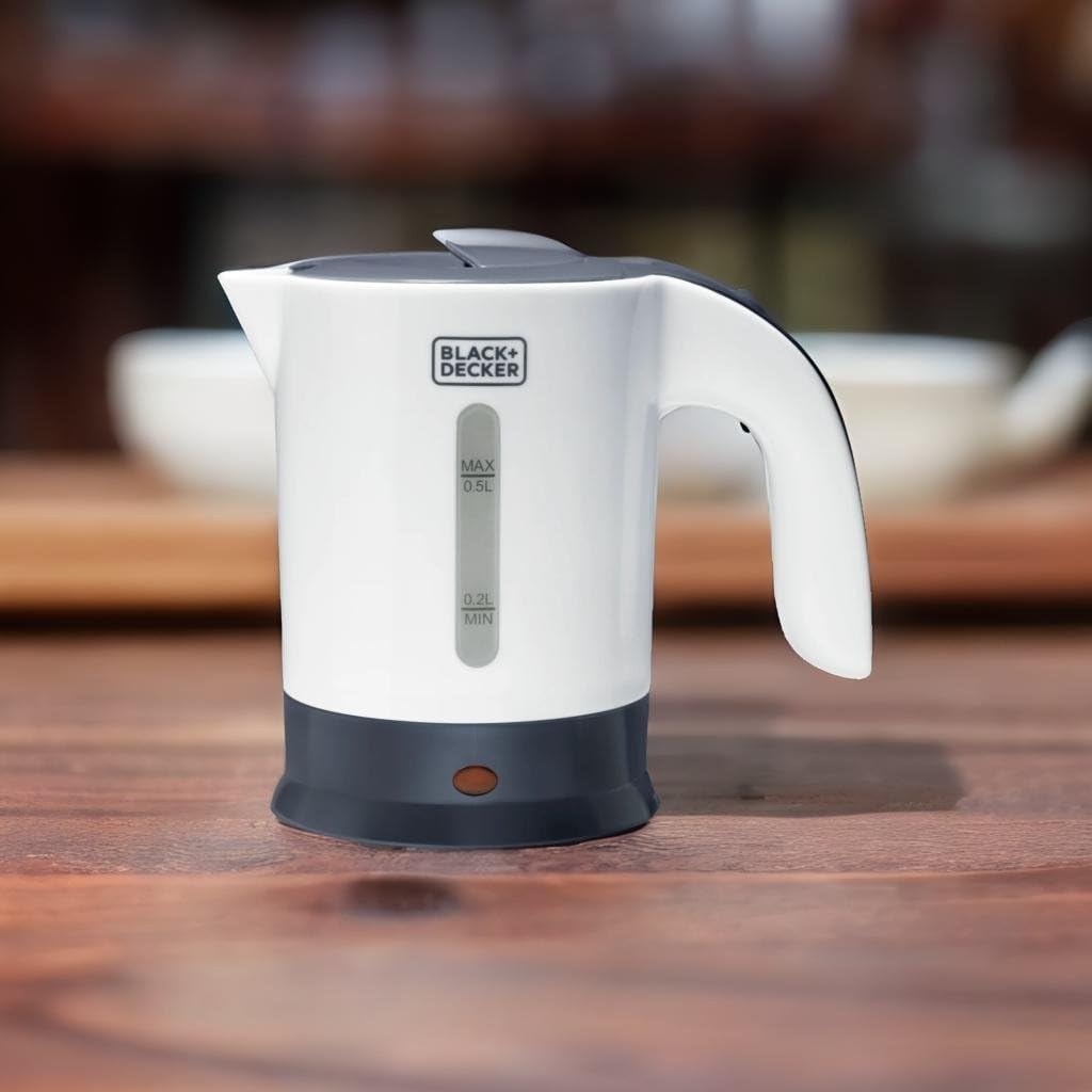 White travel kettle with dark base, handle, spout, and water level markings
