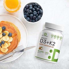 DEAL SUPPLEMENT bottle of Vitamin D3 10000 IU with K2 supplement next to pancakes blueberries and orange juice
