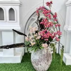 Huitich decorative fake roses for weddings in pink and white displayed in rustic stone vase
