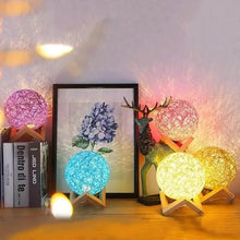 Decorative LED bedside lamps with glowing rattan sphere shades on wooden stands in multiple colors