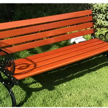 Orange slat outdoor bench seat and back on black metal frame