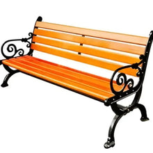 Orange slat outdoor bench with black wrought-iron scroll arms and legs