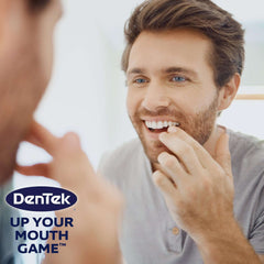 Dentek floss picks 75 count pack shown with smiling man using a floss pick in mirror and DenTek logo