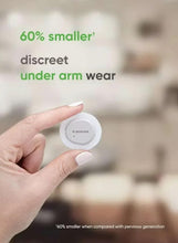 Dexcom G7 discreet sensor patch held by hand for wearing under arm