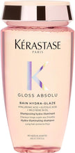 Kérastase Gloss Absolu shampoo bottle with pink liquid and rose-gold cap
