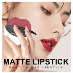 Huitich matte peach pink lipstick held near a woman's face with smooth skin and red lips