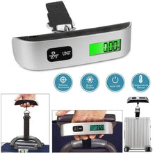 Silver digital luggage scale with green LCD screen and UNIT button, black strap
