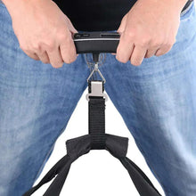 Handheld luggage scale strap held open, metal hook with luggage weight display