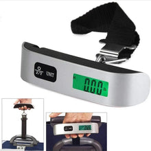 Digital luggage scale with green LCD showing weight, black grip and metal hook