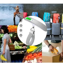 Portable digital luggage scale with gray body and hanging strap, LCD reading visible
