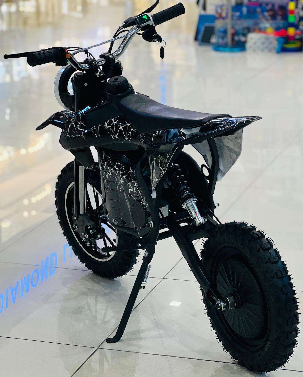 Rohan Wings black off-road electric scooter for adults with knobby tires and motorcycle style seat