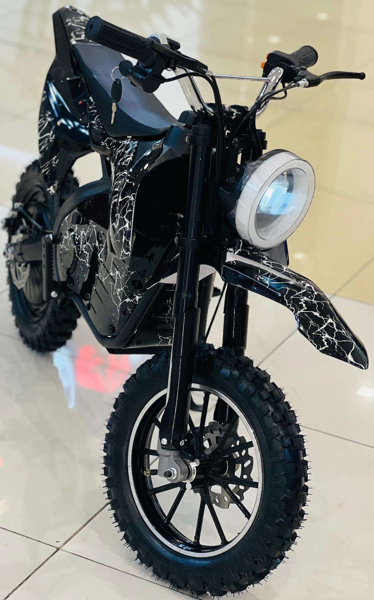 Rohan Wings off-road electric scooter for adults black frame knobby tires round headlight cracked white graphics