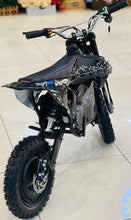 Off-road scooter black with white crack pattern, front wheel and disc rotor, kickstand