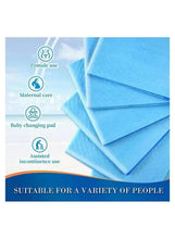 Disposable underpads, folded blue absorbent sheets stacked for incontinence care