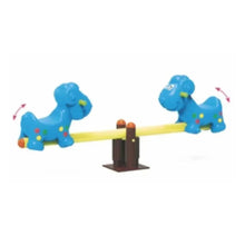 Blue dog-shaped seesaw with two standing dog figures on a yellow beam and brown base.