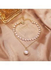 Huitich double layer pearl necklace for women with gold chain and round pearls on satin background