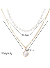 Double-layer pearl necklace with gold-tone chains, white pearl beads, round pendant