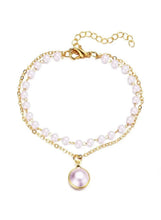 Double-layer pearl necklace with gold-tone chains and round pearl pendant