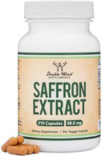 Double Wood saffron extract supplement bottle with dried saffron pieces at base