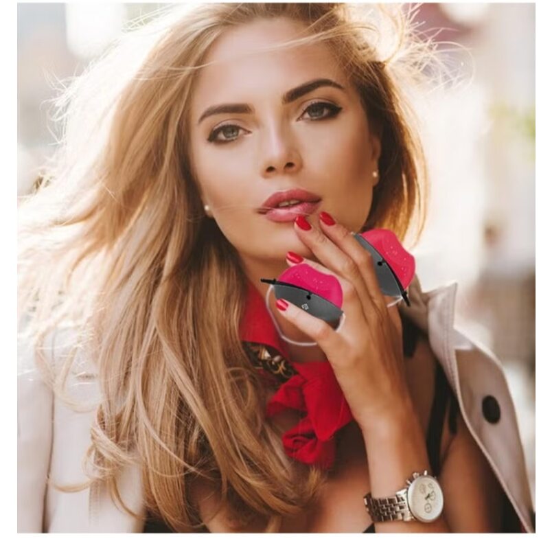 Woman applying Huitich waterproof red lipstick with matching red nails and stylish look