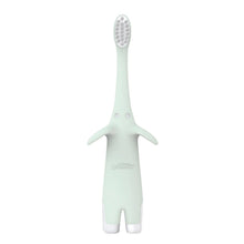 Mint elephant-shaped toothbrush with white bristles, standing upright