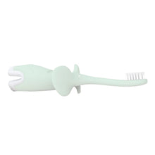 Mint elephant toothbrush with white bristles, side view