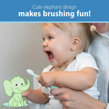 Mint elephant baby toothbrush with soft bristles, held by a laughing baby