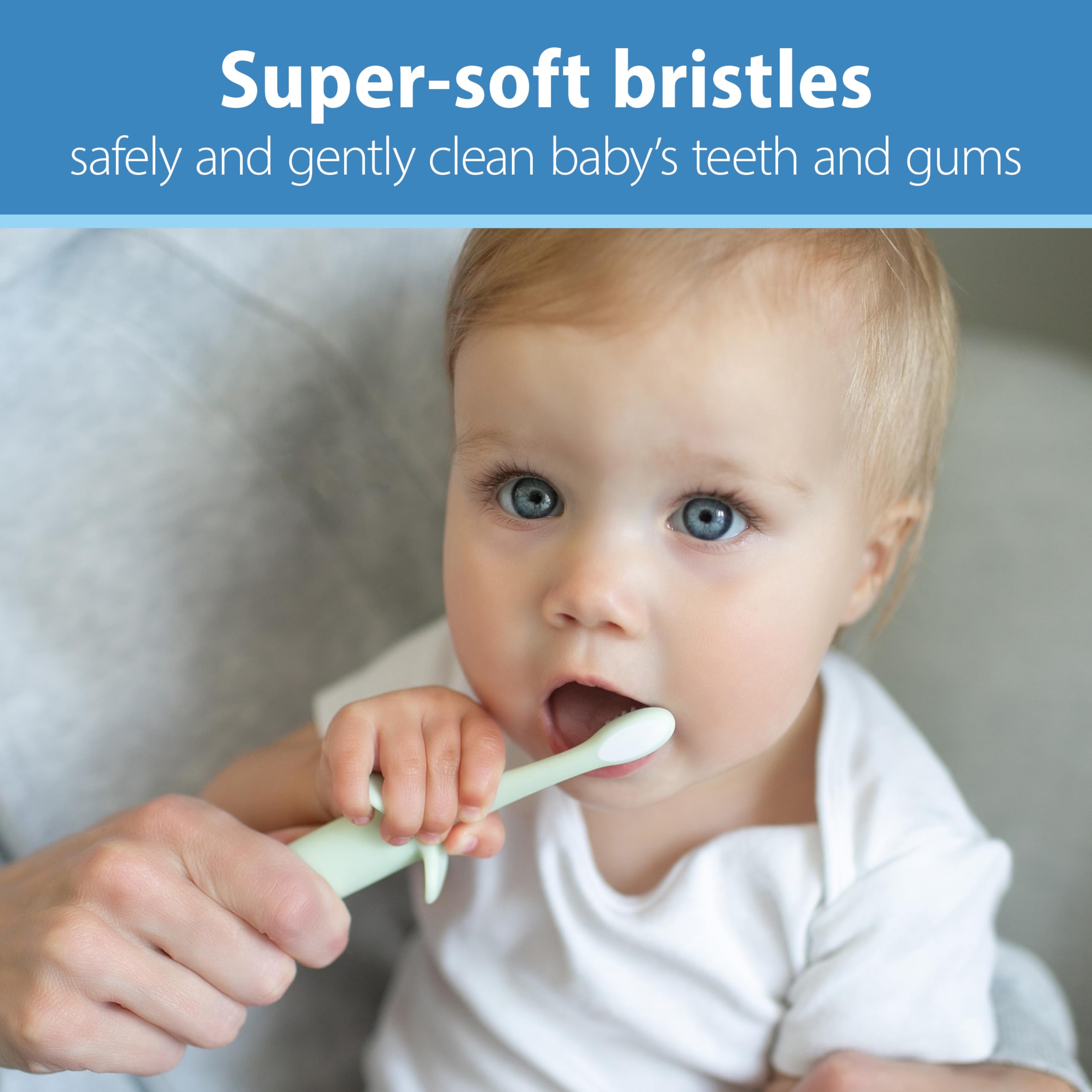 Dr Browns baby being gently brushed with mint toothbrush by caregiver infant toothbrush 0-3 years super soft bristles
