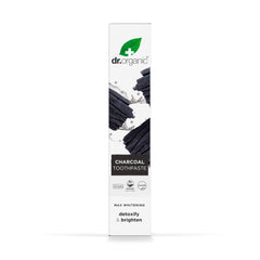 Dr. Organic charcoal toothpaste UAE tall white box packaging showing charcoal pieces and detoxify and brighten claims