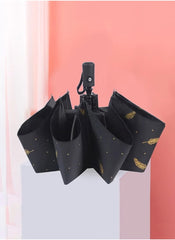Mumzar black dual purpose automatic umbrella with gold feather pattern and compact design