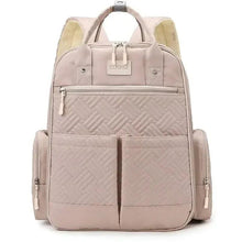 Light pink baby travel backpack with quilted front panel, zip pockets, and top handle.