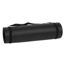 Rolled black exercise mat with attached strap