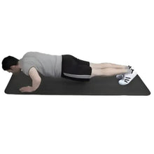 Black exercise mat used for a forearm plank