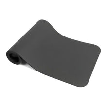 Rolled dark gray exercise mat with curved surface