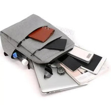 Gray laptop backpack with open top showing laptop and document sleeves.