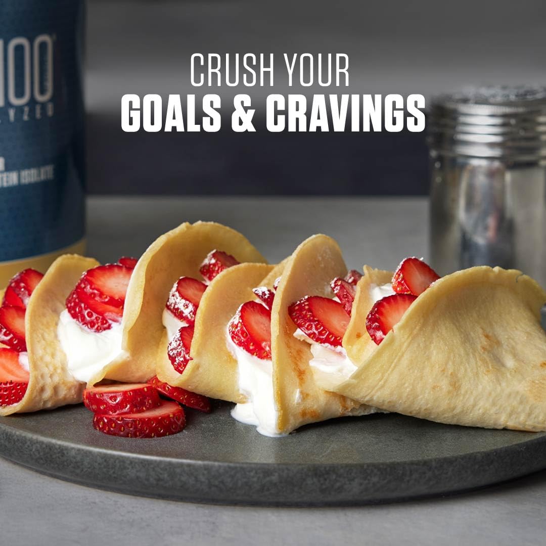 Dymatize ISO 100 whey protein UAE with strawberry cream crepes on plate and shaker bottle in background