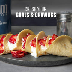 Dymatize ISO 100 whey protein UAE with strawberry cream crepes on plate and shaker bottle in background
