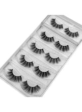 Wispy false strip eyelashes tray with multiple lash strips in clear packaging