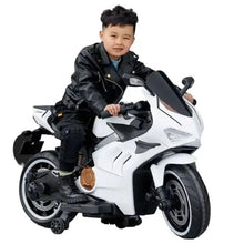 Kids electric ride-on bike, white with black accents, front view with handlebars