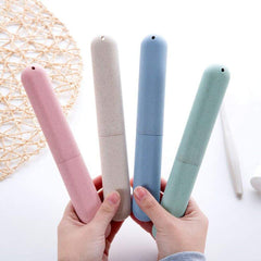 NEXCURIO travel toothbrush case set of four pastel cylindrical portable holders shown in hands