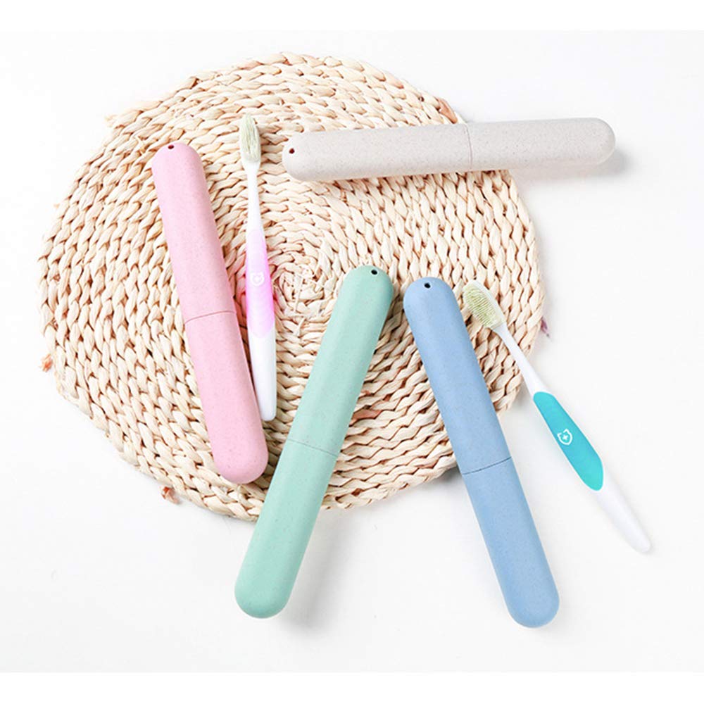 NEXCURIO travel toothbrush case set in pastel pink mint blue and beige with two toothbrushes on woven mat